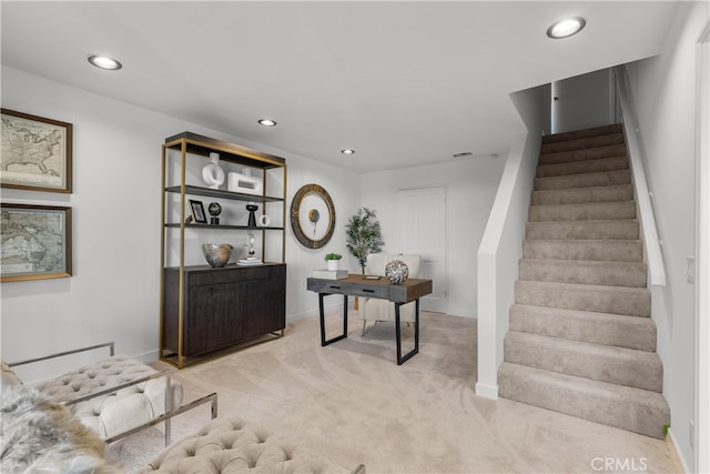 staircase featuring carpet floors