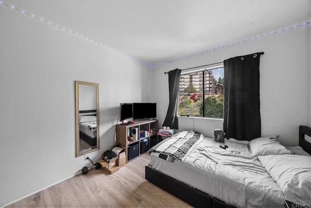 bedroom with wood finished floors