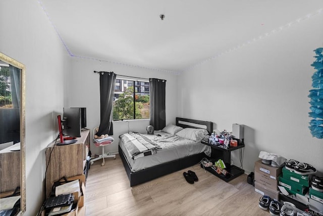 bedroom featuring wood finished floors