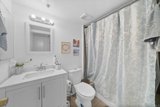 full bath featuring a shower with shower curtain, vanity, toilet, and tile patterned floors