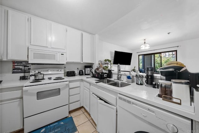 kitchen featuring white appliances, light tile patterned floors, light countertops, and a sink