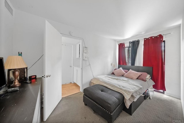 bedroom featuring carpet and visible vents