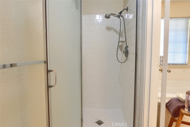 bathroom featuring an enclosed shower