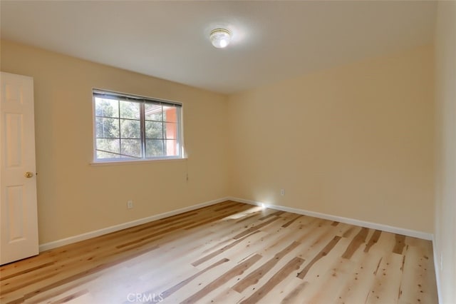 unfurnished room featuring light wood-type flooring