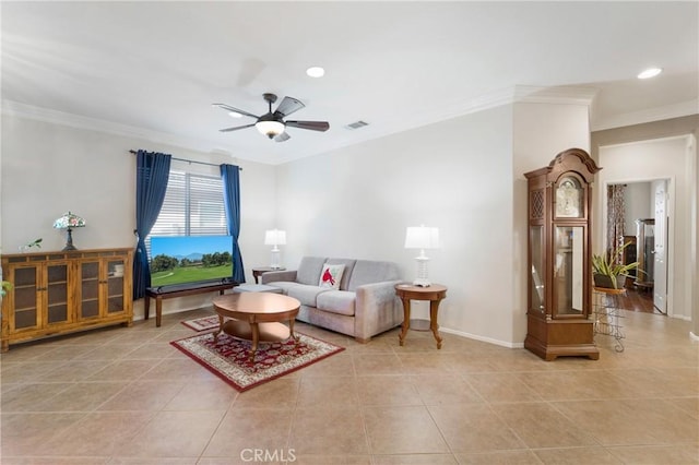 tiled living room with ceiling fan and crown molding