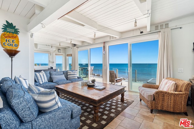 sunroom with beam ceiling, a water view, rail lighting, and wooden ceiling