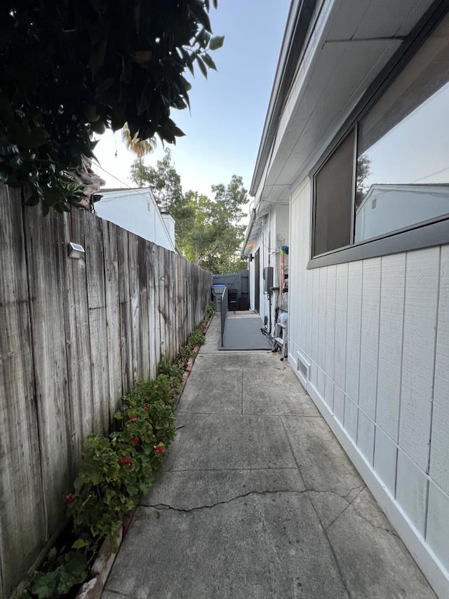 view of side of home with a patio