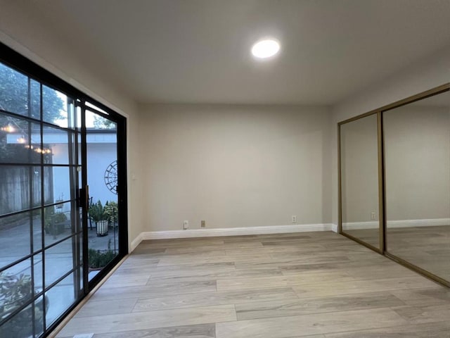 interior space with a closet and light wood-type flooring