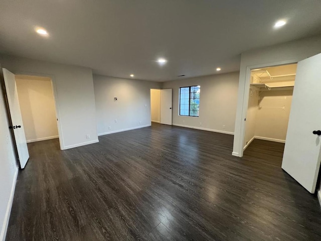 spare room with dark hardwood / wood-style floors