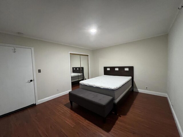 bedroom featuring dark hardwood / wood-style floors