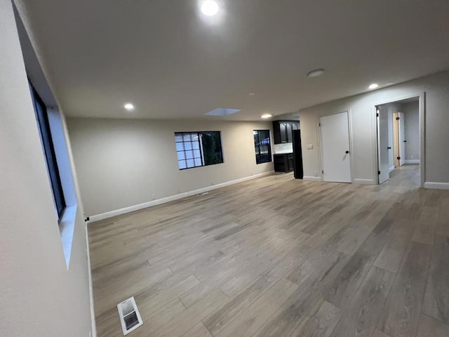 basement featuring hardwood / wood-style floors