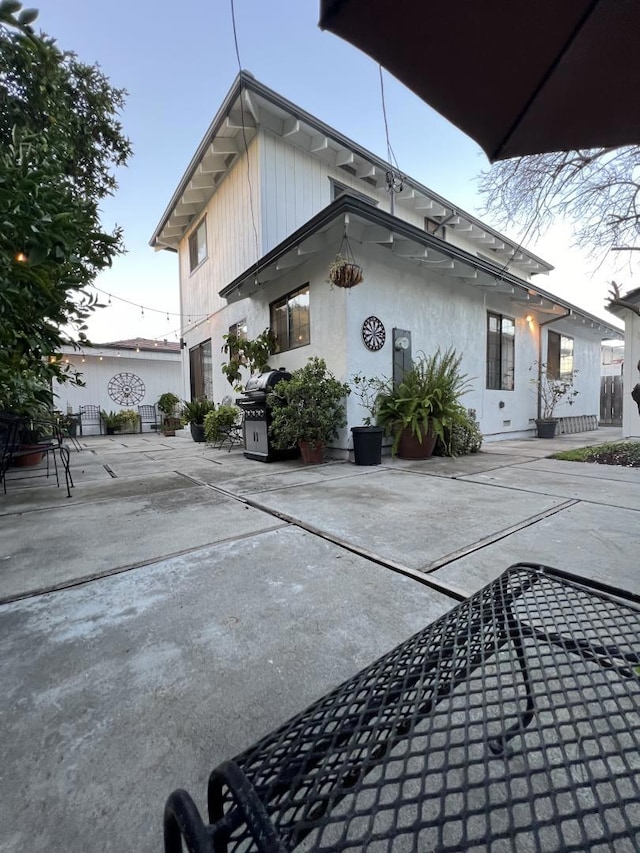 rear view of property featuring a patio