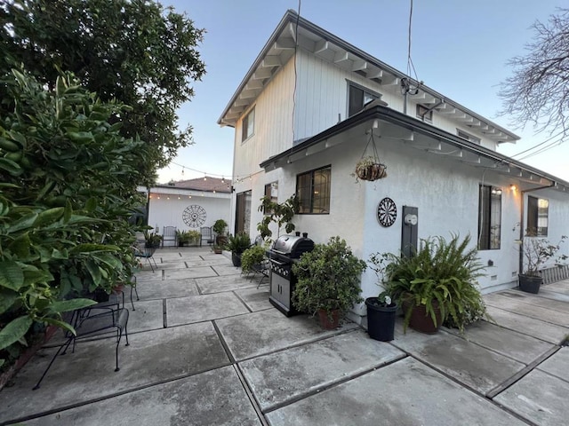 rear view of property featuring a patio area