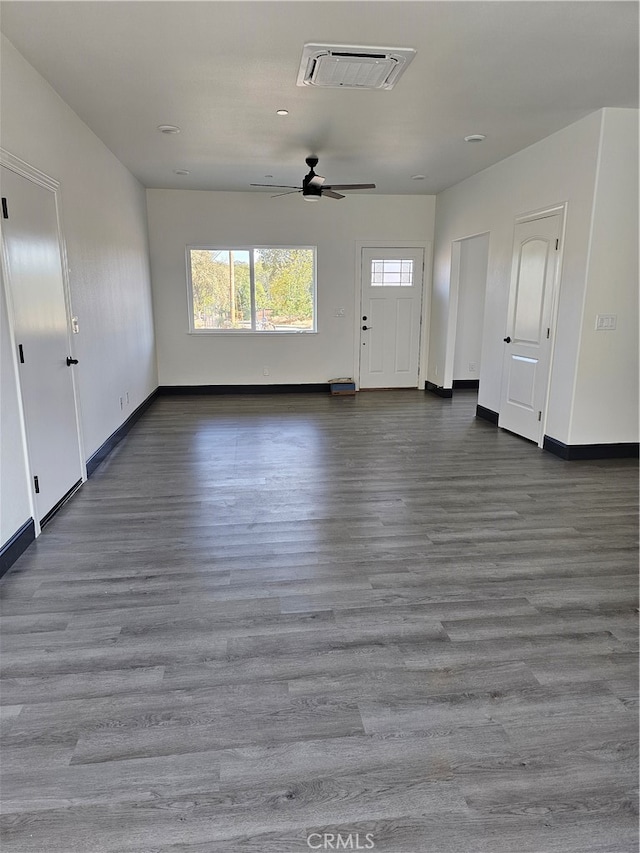 unfurnished living room with ceiling fan and hardwood / wood-style flooring