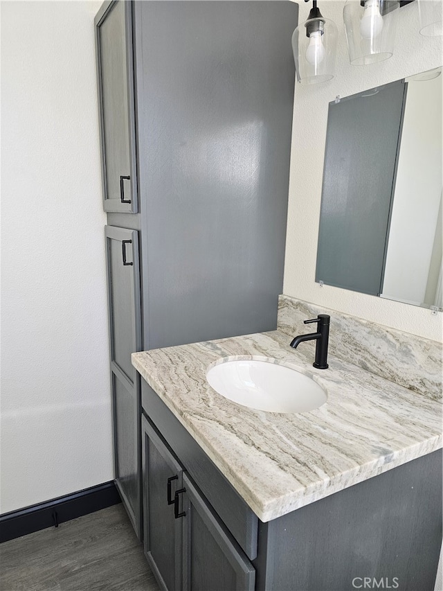 bathroom featuring vanity and hardwood / wood-style flooring