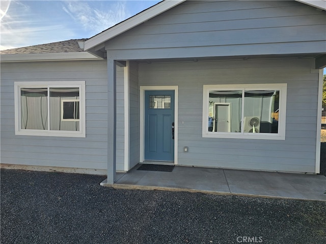 doorway to property featuring a patio area