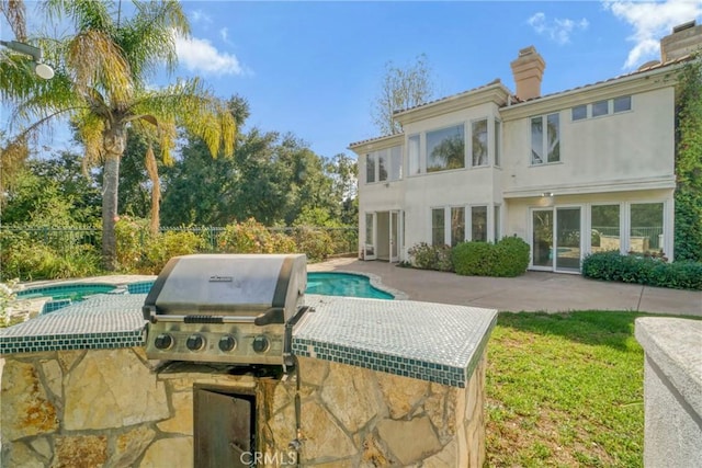 view of patio featuring a fenced in pool, fence, and area for grilling