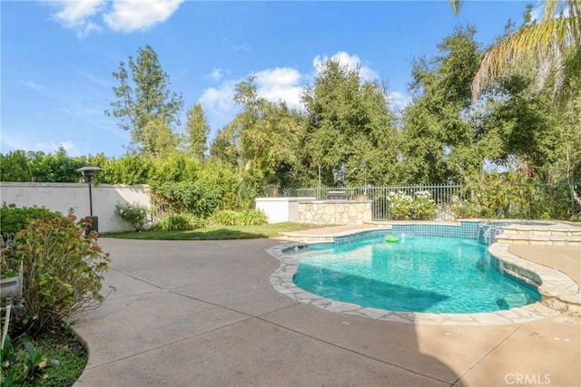 view of swimming pool with a patio area, fence private yard, and a fenced in pool