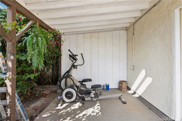 workout area featuring concrete flooring