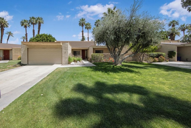 view of front facade with a garage and a front lawn