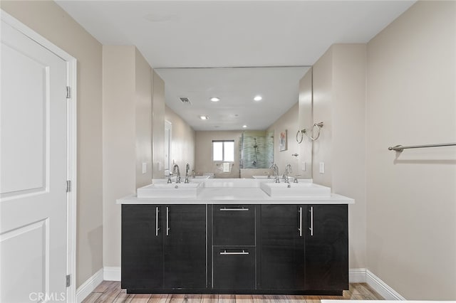 bathroom featuring vanity and hardwood / wood-style flooring