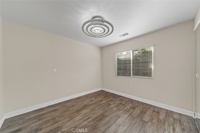 empty room featuring dark hardwood / wood-style floors