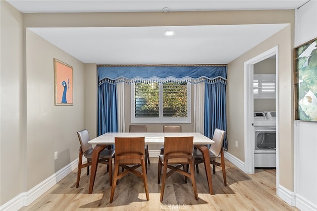 dining room featuring light hardwood / wood-style floors and independent washer and dryer