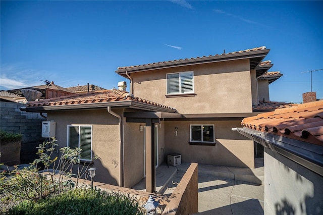 rear view of house with a patio