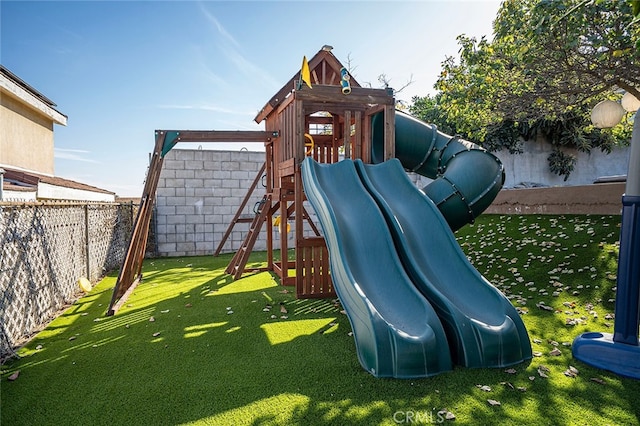 view of jungle gym featuring a lawn