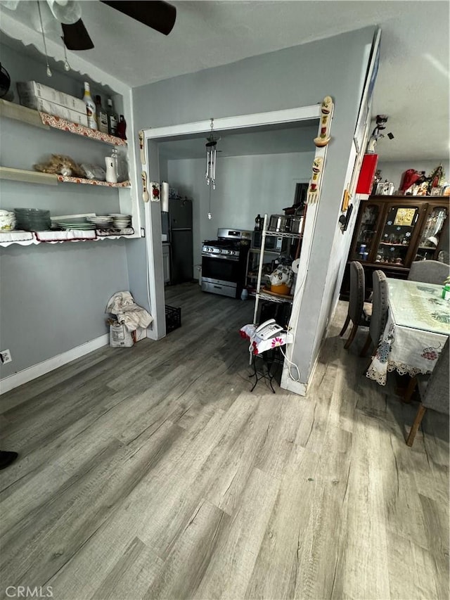 interior space featuring ceiling fan and wood-type flooring