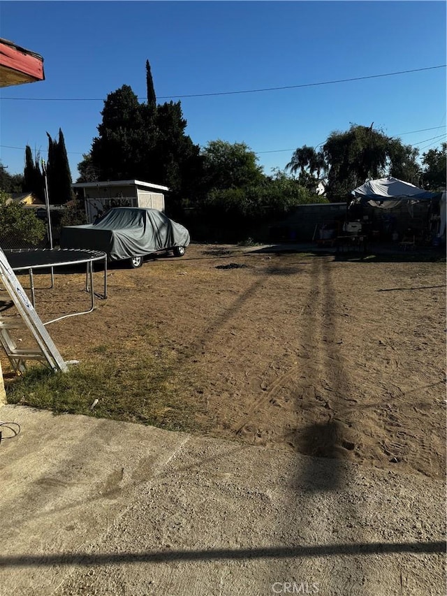 view of yard with a trampoline