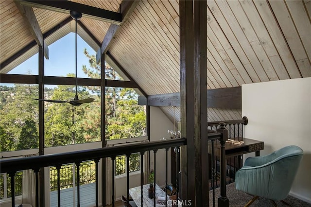 sunroom with vaulted ceiling with beams