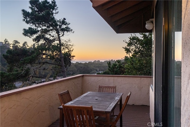 view of balcony at dusk