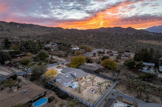 aerial view at dusk with a mountain view