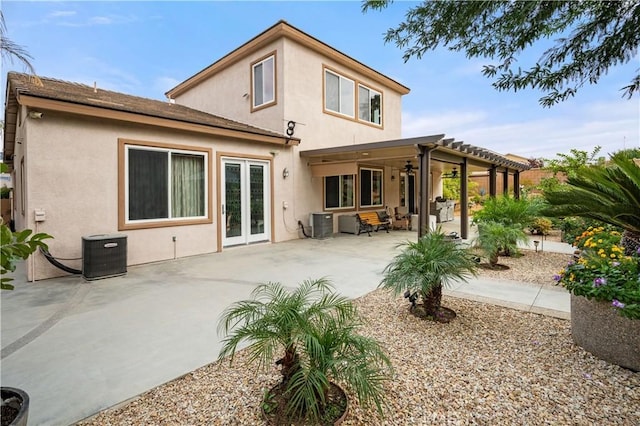 rear view of house with ceiling fan, a patio, and central AC unit