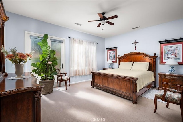 bedroom featuring light carpet and ceiling fan