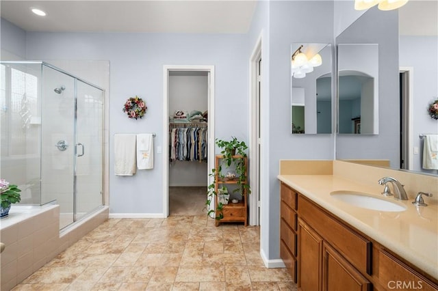 bathroom with vanity and an enclosed shower