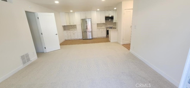 2511 W Sunflower Ave Unit P6, Santa Ana, CA 92704 - kitchen featuring recessed lighting, visible vents, white cabinetry, and appliances with stainless steel finishes