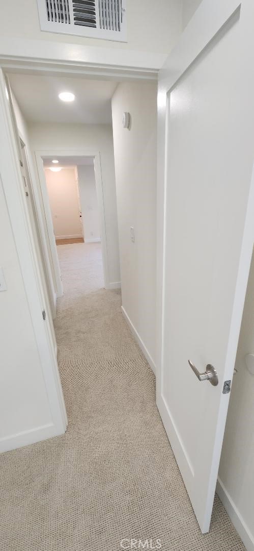 2511 W Sunflower Ave Unit P6, Santa Ana, CA 92704 - corridor featuring visible vents, baseboards, and light colored carpet