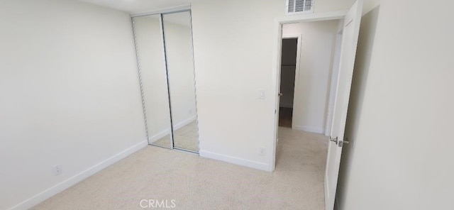 2511 W Sunflower Ave Unit P6, Santa Ana, CA 92704 - unfurnished bedroom with visible vents, baseboards, a closet, and carpet