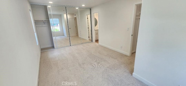 2511 W Sunflower Ave Unit P6, Santa Ana, CA 92704 - unfurnished bedroom with a closet, baseboards, ensuite bathroom, recessed lighting, and carpet flooring