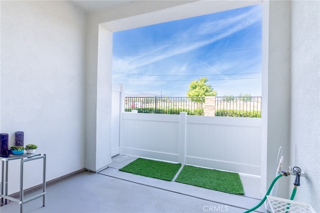 doorway featuring concrete flooring and plenty of natural light