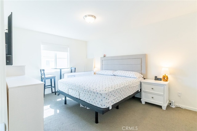 bedroom featuring light colored carpet