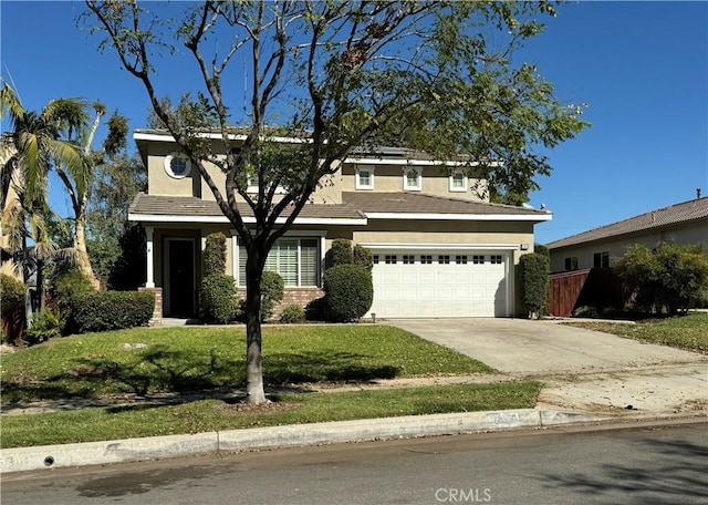 view of front of house with a garage and a front yard