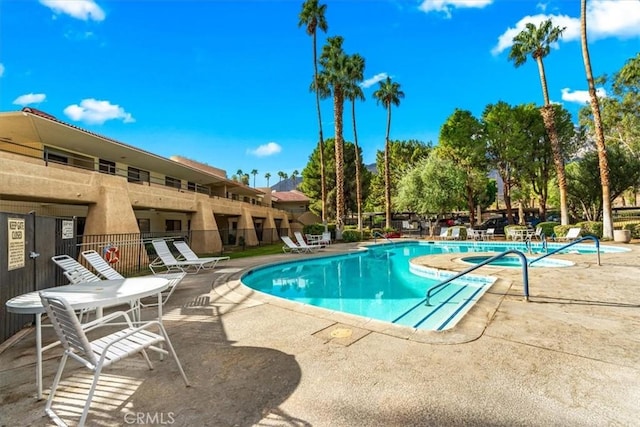 view of swimming pool featuring a patio area