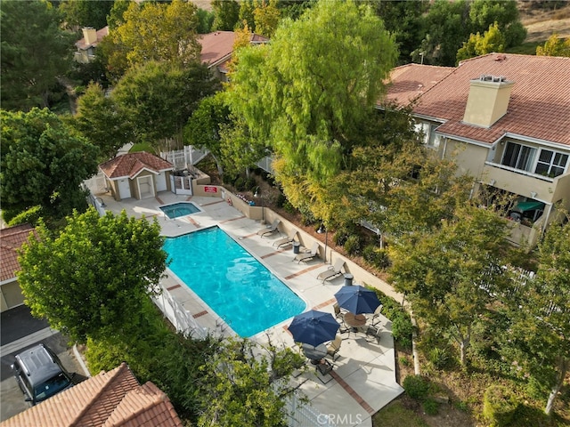 view of swimming pool with a patio area and grilling area