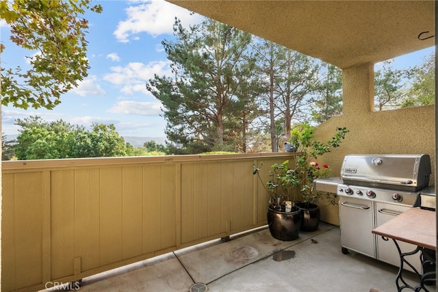 view of patio featuring a grill