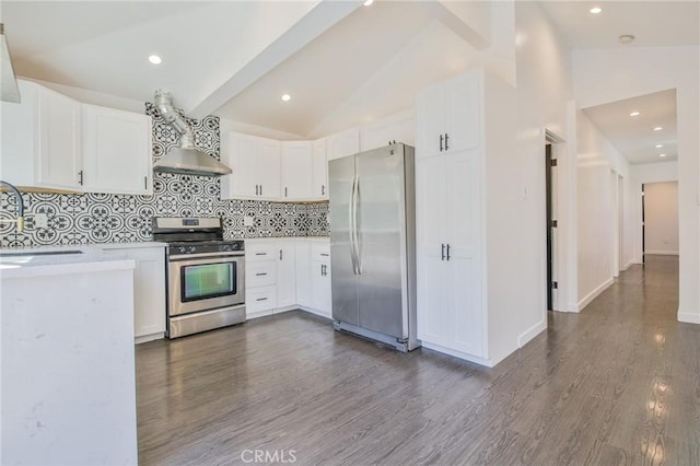 kitchen with stainless steel appliances, white cabinets, light countertops, and vaulted ceiling with beams