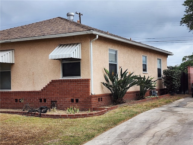 view of home's exterior featuring a yard