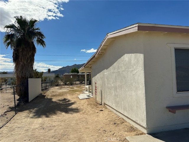 view of home's exterior with a mountain view